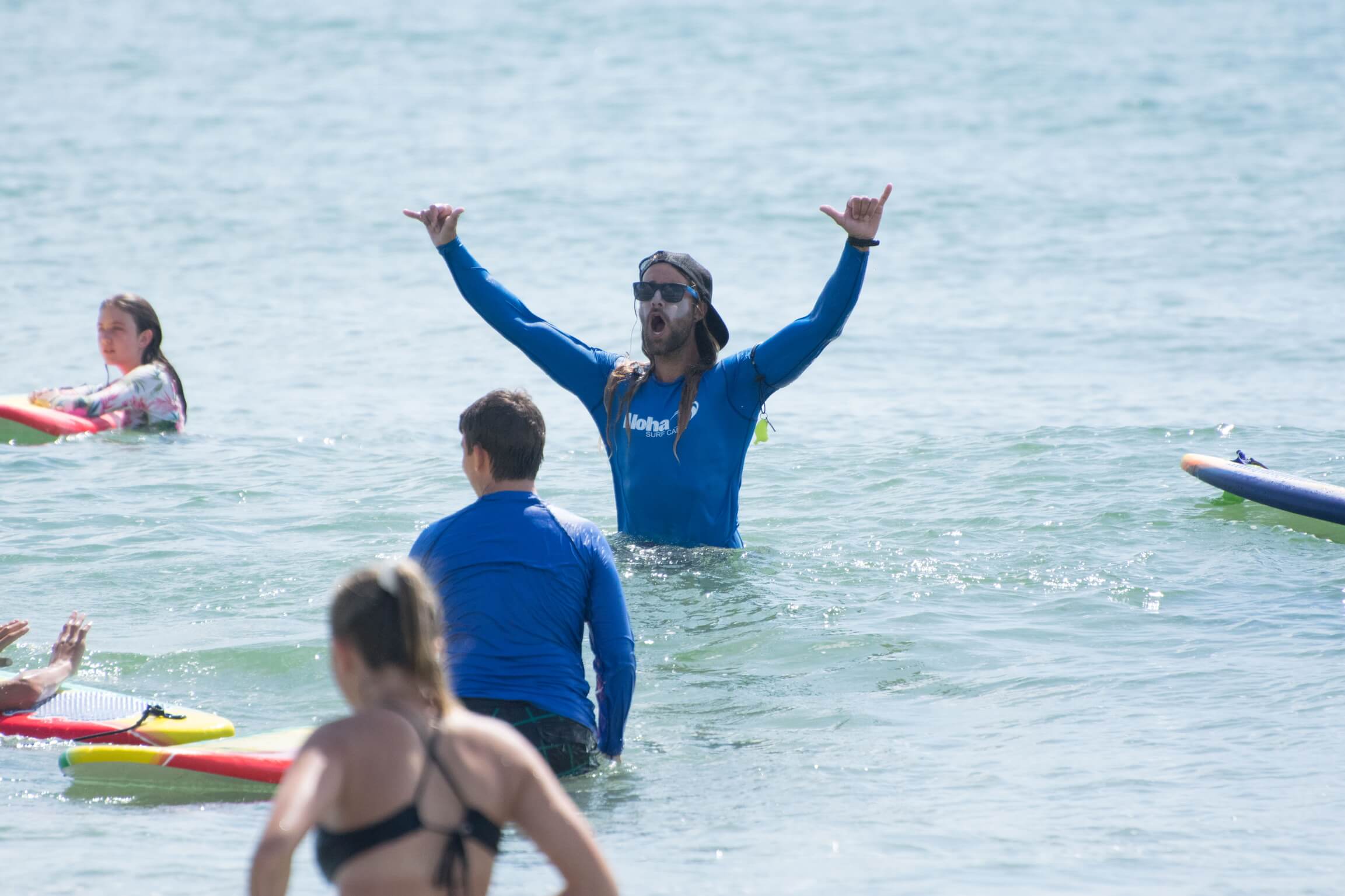 Surfer with arms raised in pure stoke