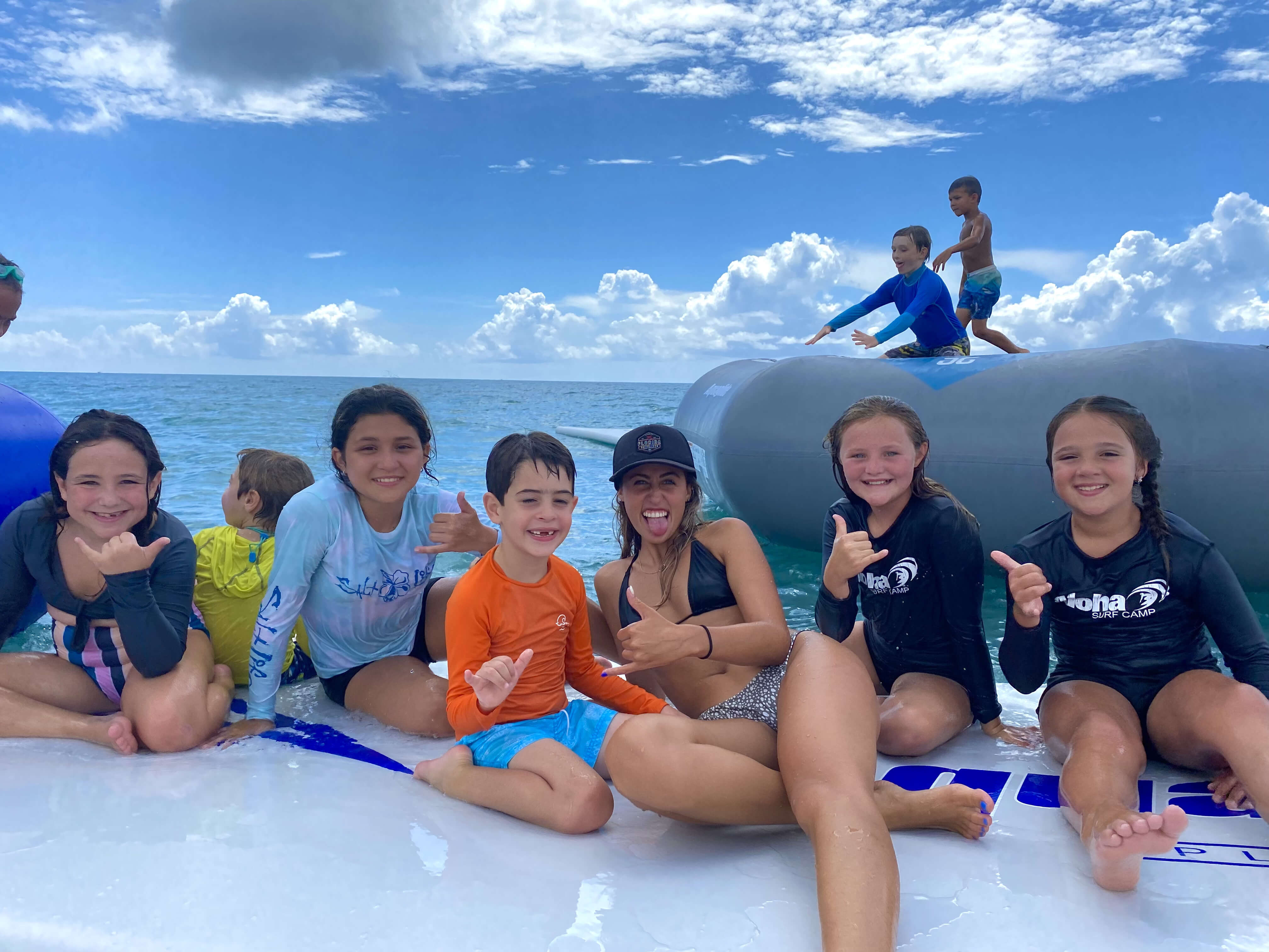 Group of campers having fun in the surf