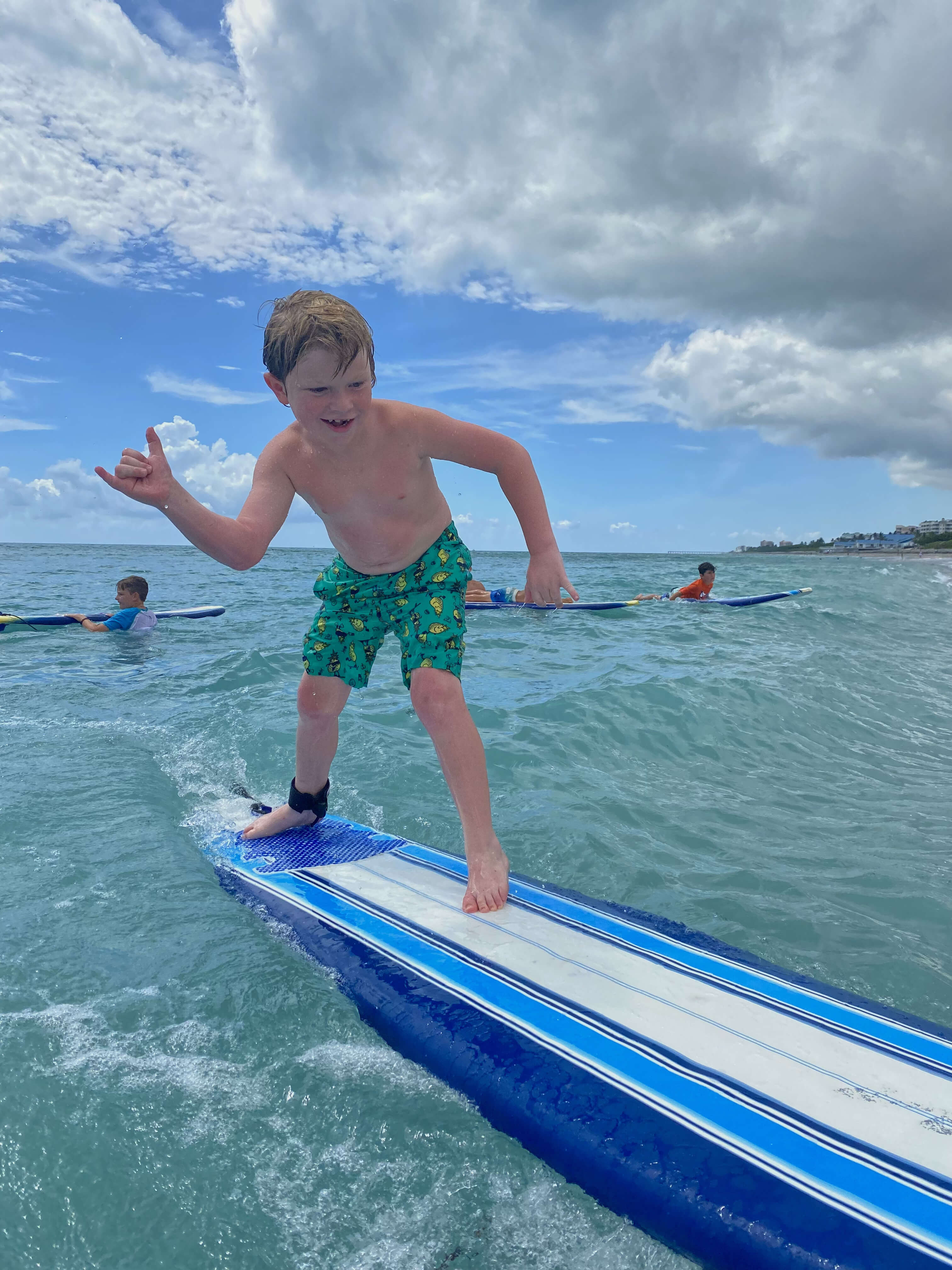 Camper throwing a hang loose shaka sign