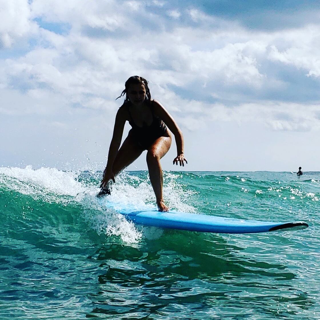 Group of kids surfing together