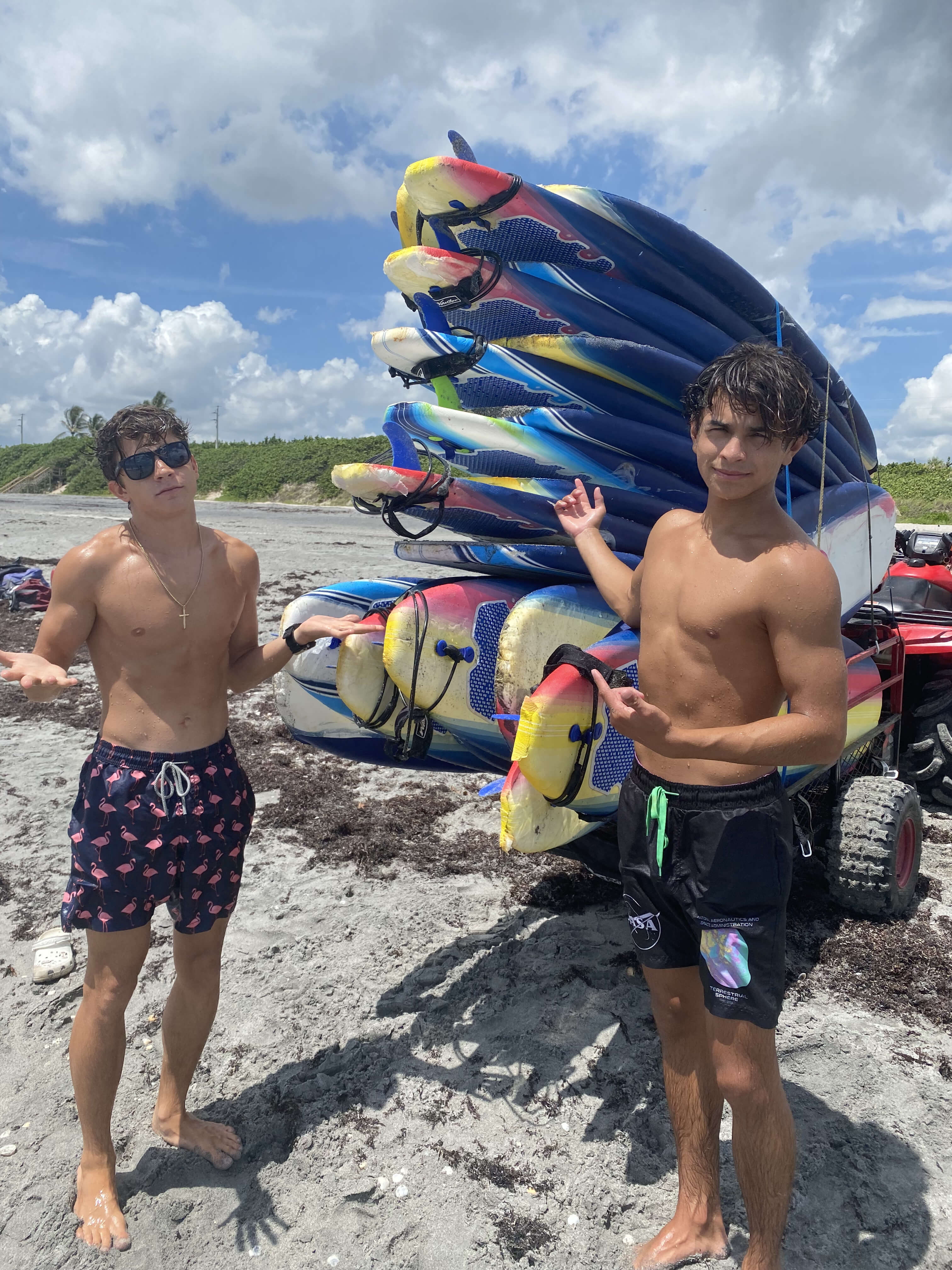 Two campers checking their board before surfing