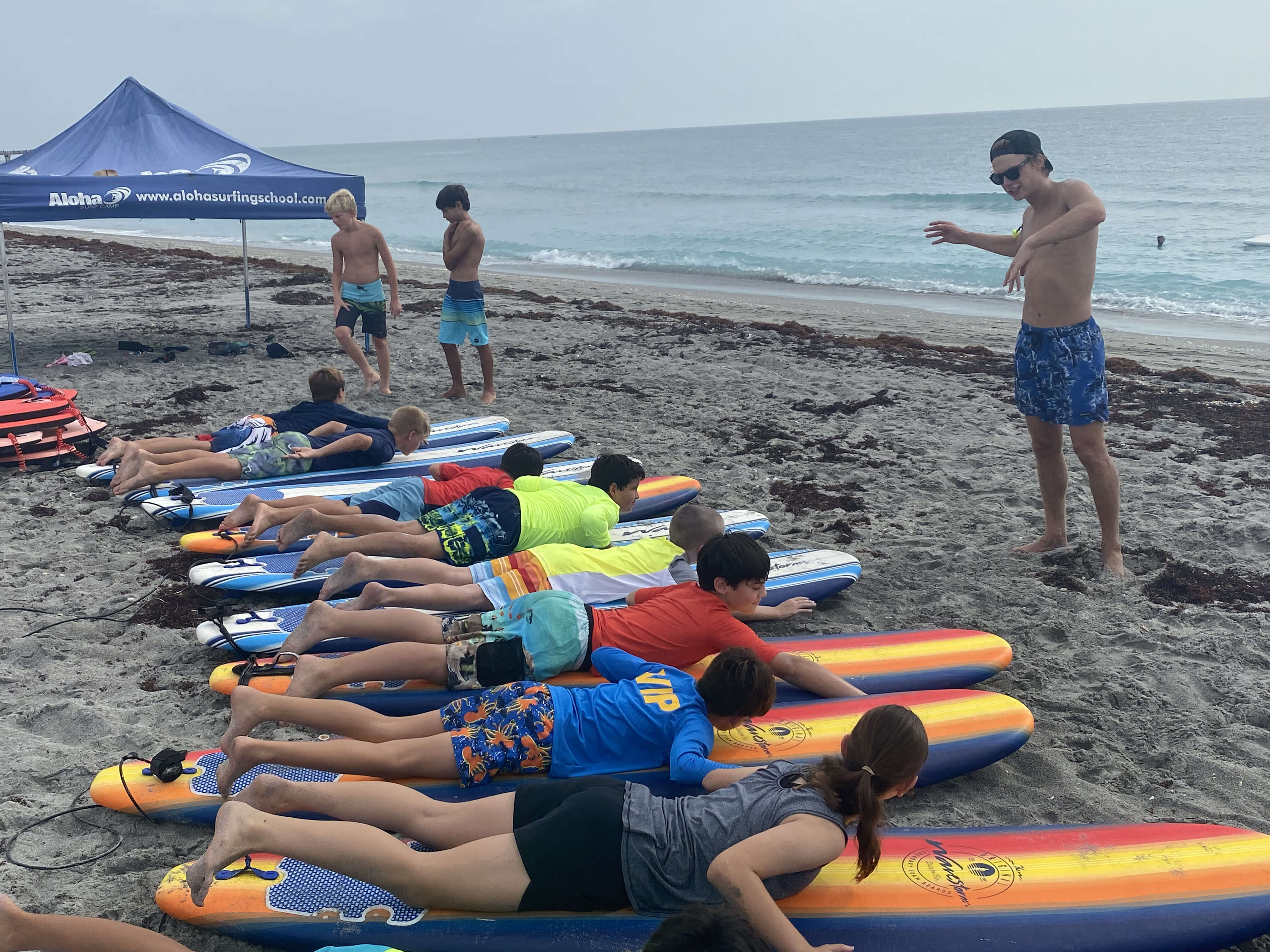 Taylor surfing with a group of campers